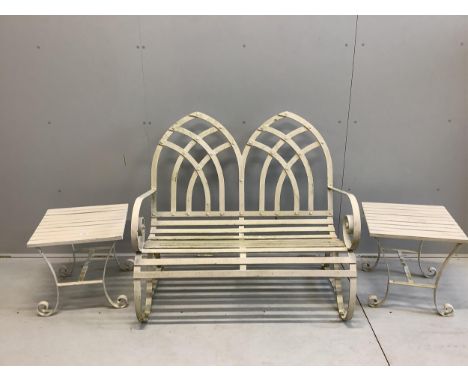 A Camelia Botnar Gothic style wrought iron garden bench, width 106cm, depth 61cm, height 99cm together with a pair of wrought