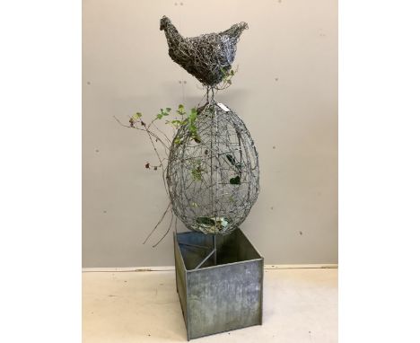 A Rupert Till wire work sculpture 'Chicken or Egg', on galvanised square trough base, height 164cm. Condition - weathered but