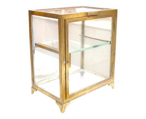 A small late 19th century brass display case, with glass shelf, bears plaque  'J Weiss &amp; Son, 287 Oxford Street, London",