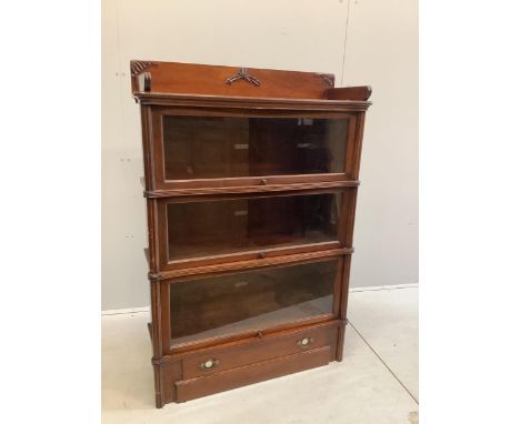 A Globe Wernicke mahogany three section bookcase, width 92cm, depth 33cm, height 135cm. Condition - fair