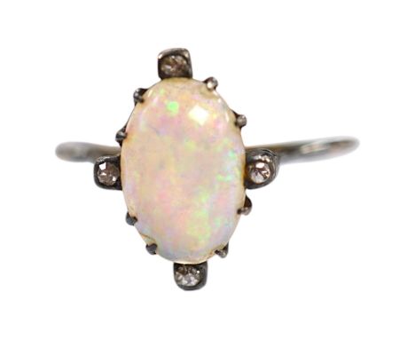An antique, yellow and white metal, white opal and diamond set ring, size T, gross weight 2.1 grams. Condition - poor to fair
