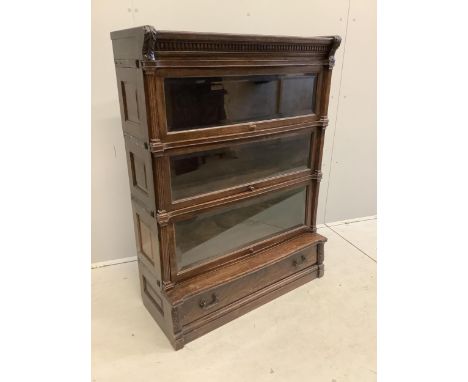 A Globe Wernicke oak three section bookcase, width 90cm, depth 38cm, height 121cm. Condition - fair Missing the lock on the b