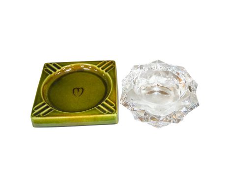 A Baccarat ashtray, 19cm diameter, and a Gefle Swedish ashtray, 20cm wide. Condition - good.