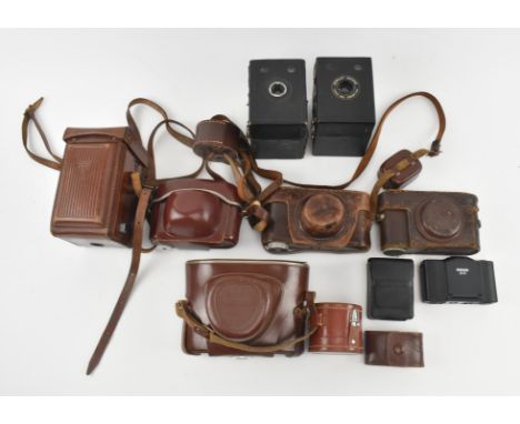 A large collection of early 20th century cameras &amp; accessories. The lot to include two Popular Brownie Takes 620 Kodak fi