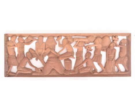 A 20th century African carved tribal hardwood decorative panel. The panel depicting various figures carrying tools / offering