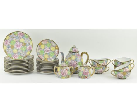 A vintage mid 20th century fine bone china tea service. The service heavily decorated with enamel flowers in various colourwa