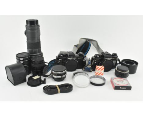 A collection of vintage 20th century cameras, camera accessories, lenses etc. The lot to include two Praktica BC1 electronic 