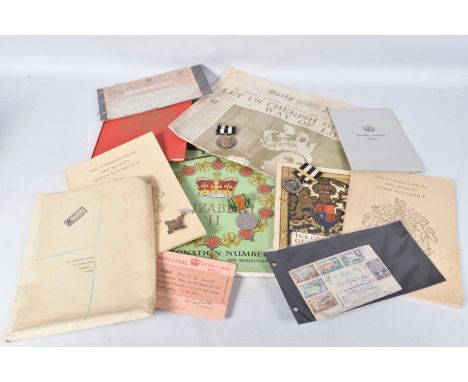 TWO SAINT JOHNS AMBULANCE MEDALS, a WWII defence medal, 1953 books, a ticket to Queen Elizabeth II coronation and a telegram 