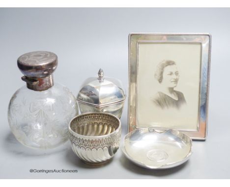   A George V panelled silver tea caddy, Sheffield, 1918, 10.2cm, a late Victorian silver bowl, a silver mounted glass scent b