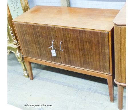   A Gordon Russell Ltd teak and Indian laurel 2 door side cabinet, model R 803 circa 1960, length 101cm, depth 42cm, height 7