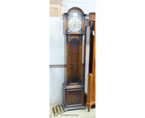   A 1920's oak longcase clock, height 193cm