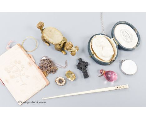   A small group of assorted bijouterie including base metal and composite poodle pin cushion, a white metal and enamel locket