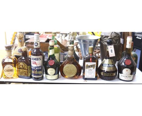   A group of assorted spirits and liqueurs including whisky;Cardhu, Columba cream, Lambs Navy rum, Benedictine x 3 (one vinta