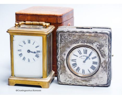   A cased carriage clock and a silver mounted motorwatch