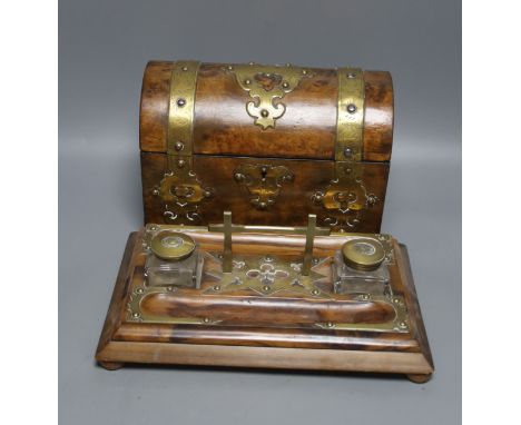   A 19th century domed brass mounted tea caddy, 23 x 18cm and a two bottled ink stand