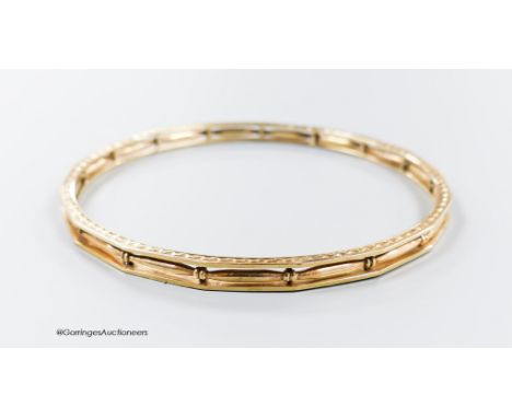   A pierced 9ct bangle, interior diameter 68mm, 13.2 grams.