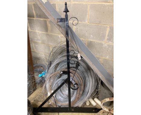   A large wrought iron sign bracket, possibly from a public house.