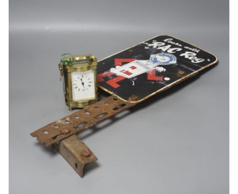   An RAC Reg advertising enamel sign and a brass cased carriage timepiece