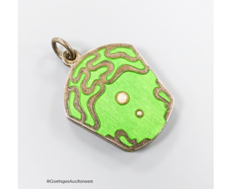   An early 20th century Austro-Hungarian white metal, green enamel and split pearl set locket, with mirrored interior, 32mm.