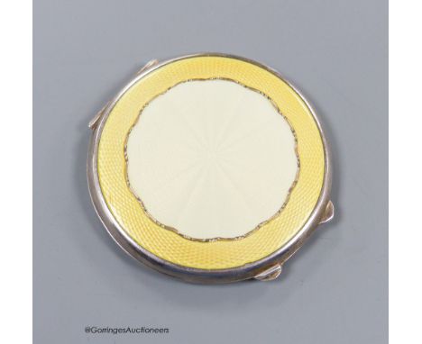   A George VI silver and yellow guilloche enamel circular compact, Birmingham, 1944, 65mm.