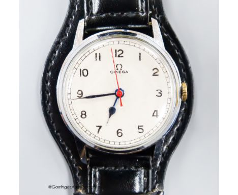   A gentleman's early 1940's stainless steel Omega manual wind wrist watch, on later associated strap, case diameter 34mm.