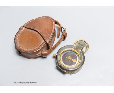   A World War I compass in leather case