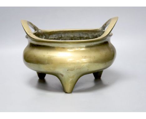   A large Chinese bronze tripod censer Xuande mark, early 20th century, 25cm wide