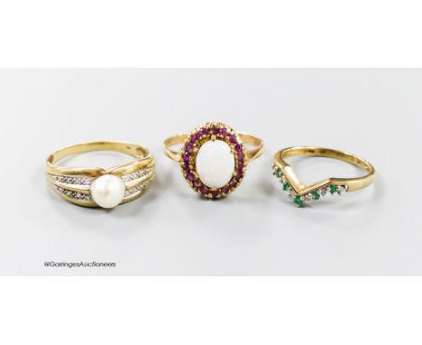   Two 9ct gold and gem set rings, ruby and white opal cluster and emerald and diamond herringbone and a 375 and cultured pear