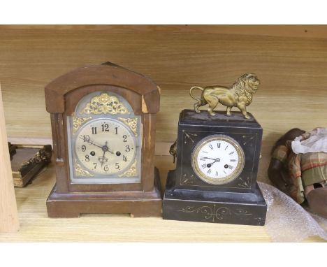   A slate mantel clock with lion surmount and a mahogany mantel clock