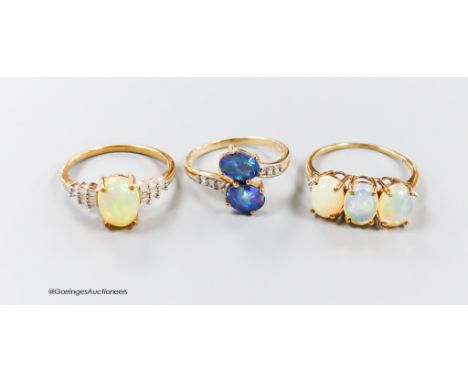   Two modern 9ct gold, opal and diamond set dress rings, size P &amp; P/Q and one other 9ct gold and two stone opal doublet s