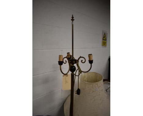 A vintage brass three branch standard lamp