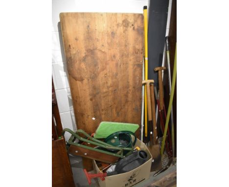 A Victorian pine utility folding table and a selection of garden tools