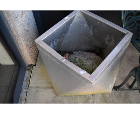 An aluminium planter in the modernist style