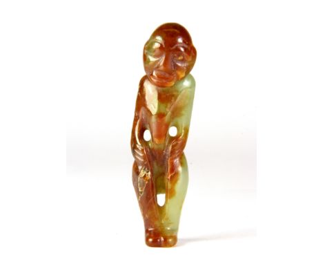 An interesting Japanese mixed colour jade figural netsuke, H. 8cm.