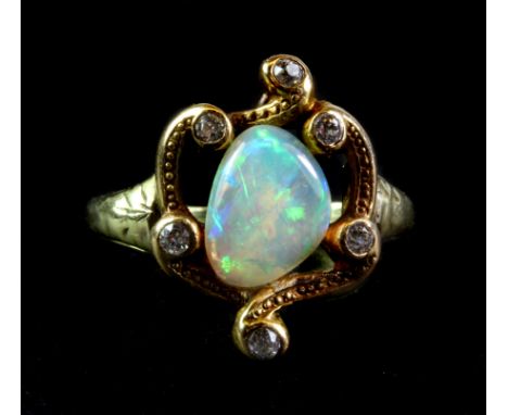 A 14ct yellow gold diamond and opal set ring, (M).