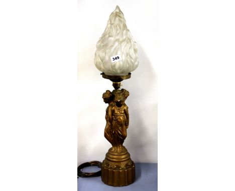 A 1930's gilt classical plaster table lamp with original flame shade, H. 68cm.
