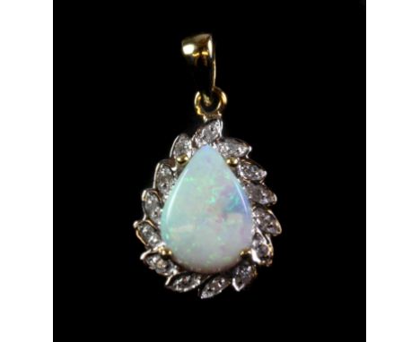 A 9ct yellow gold opal and diamond set pendant.