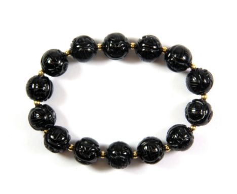 A 9ct yellow gold and black jade bead bracelet.