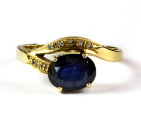 A 14ct yellow gold (stamped 14k) sapphire and diamond ring, (K).