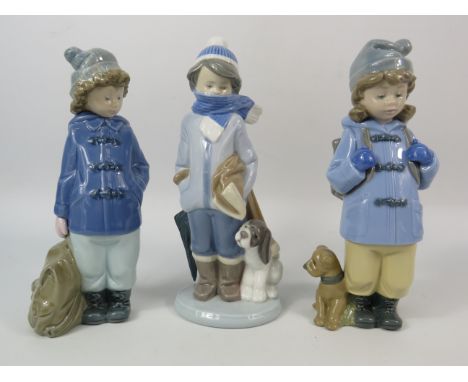 Two Nao and one Lladro figurines of young boys, the tallest measures 8".