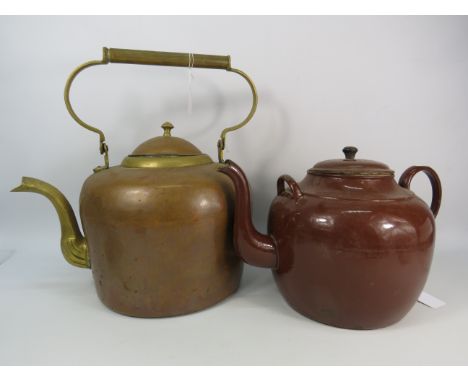 Two Extra large teapot, one brass one enamel. The largest measures 16.5" tall and 16" long.