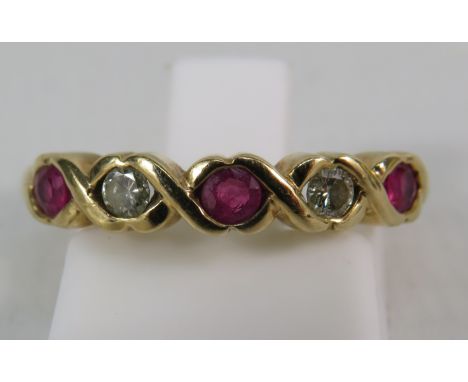 9ct gold diamond and ruby twist half eternity ring, finger size "L" . 2.7 grams