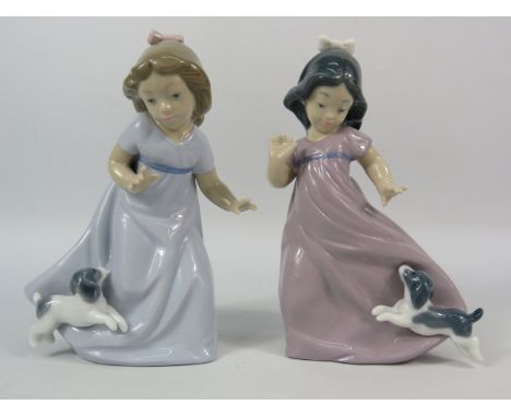 Two Nao figurines of young girls with dogs, 6.5" tall.