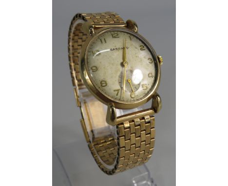 Gents Garrard wristwatch with 9ct gold body and rolled gold strap, in running order. (inscription to the back plate)