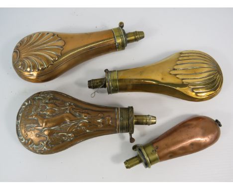 Four antique brass and copper powder flasks, one arrow marked by James Dixon &amp; sons.