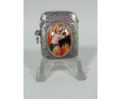 Very Pretty Silver Vesta with an oval enamel cabouchon swhich depicts a semi nude lady in flames. Scrolled Decoration. Hallma