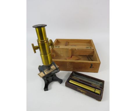Small vintage brass microscope and a direct vision spectoscope both with original cases.