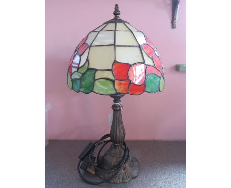 Metal Based table lamp with Tiffany style shade.  Measures approx 18 inches tall.  See photos. 
