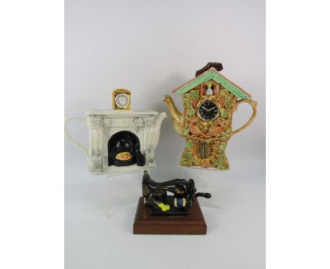 Two Swineside collectable teapots and a Paul Cardew ceramic sewing machine( missing lid).