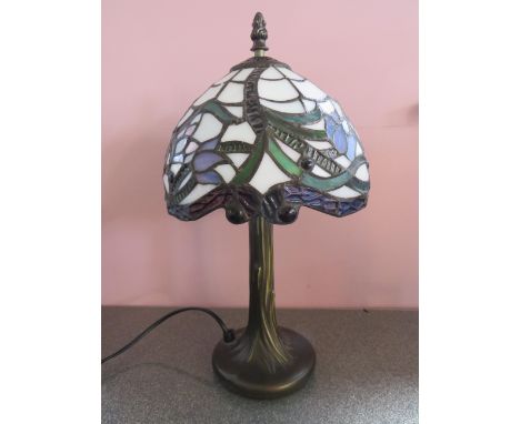 Metal Based table lamp with Tiffany style shade.  Measures approx 15 inches tall.  See photos. 